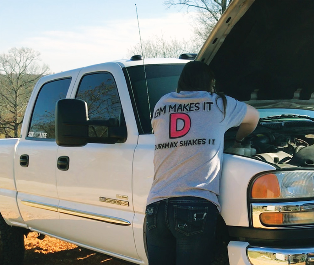 Working on the engine of the White 2006 2500HD LBZ