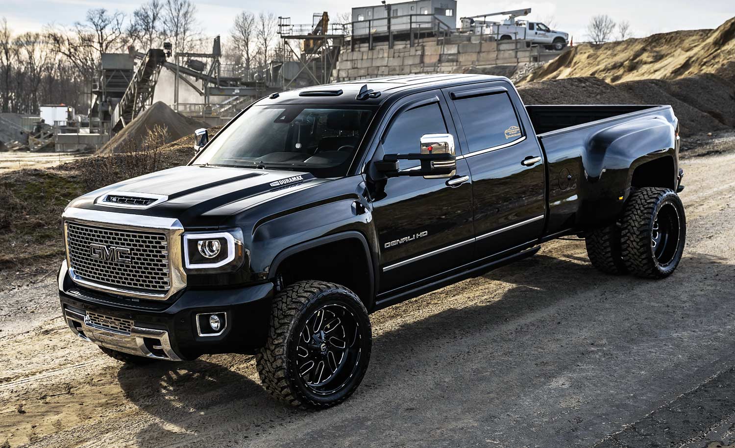 black 6 wheel truck parked on a hill