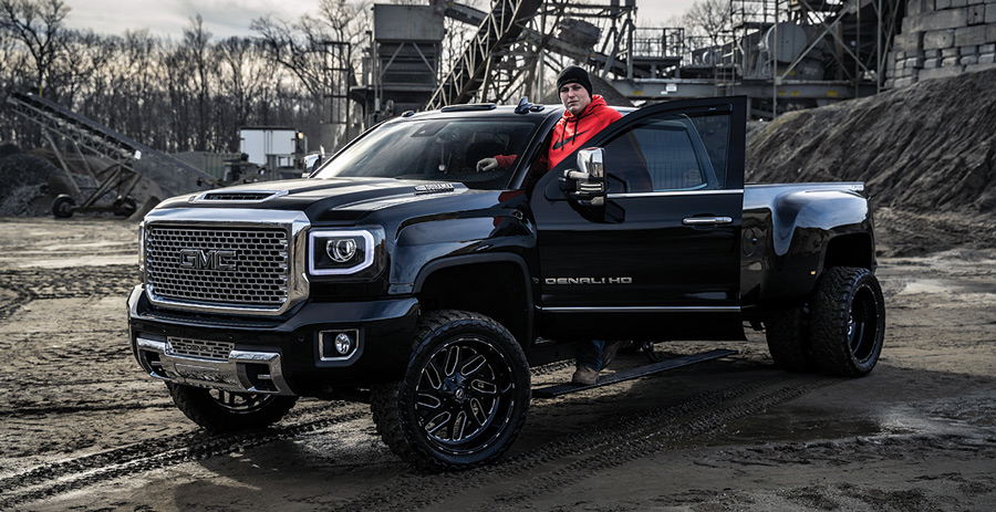 man posing with his truck