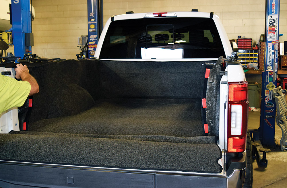 Securing bedliner with fasteners