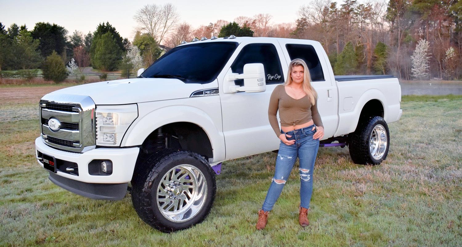 Ryan Copsey standing in front of her 2015 6.7 F350