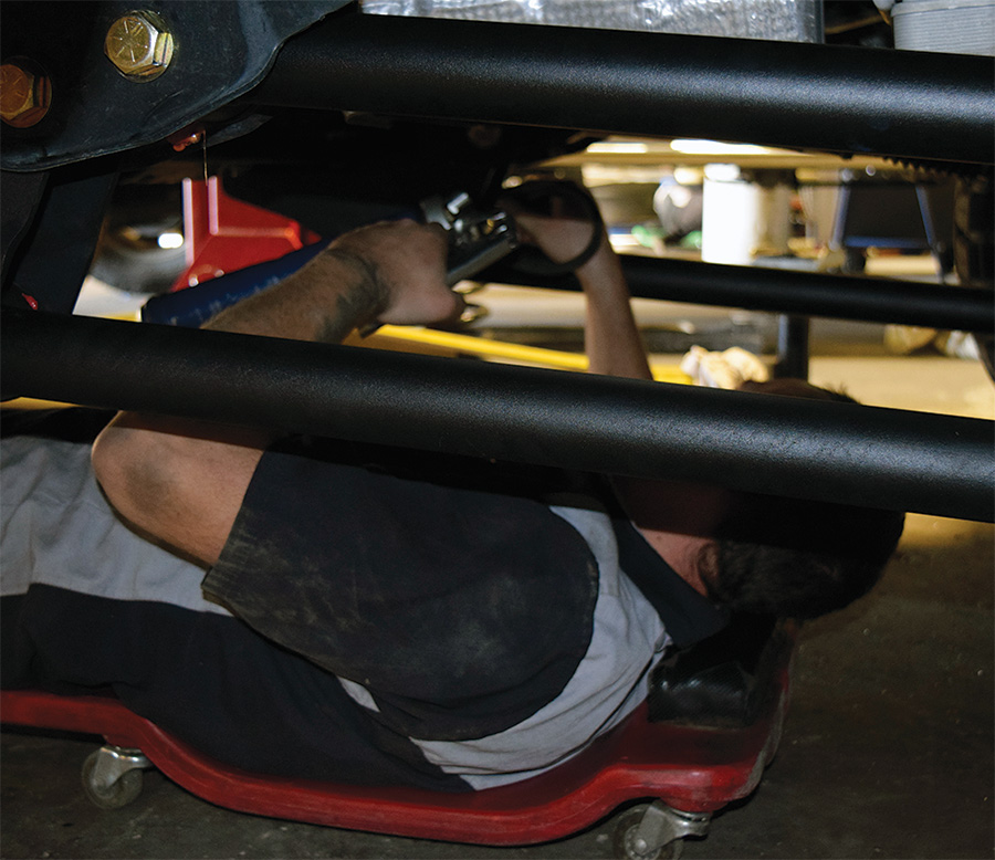 power wires up into an opening near the passenger side