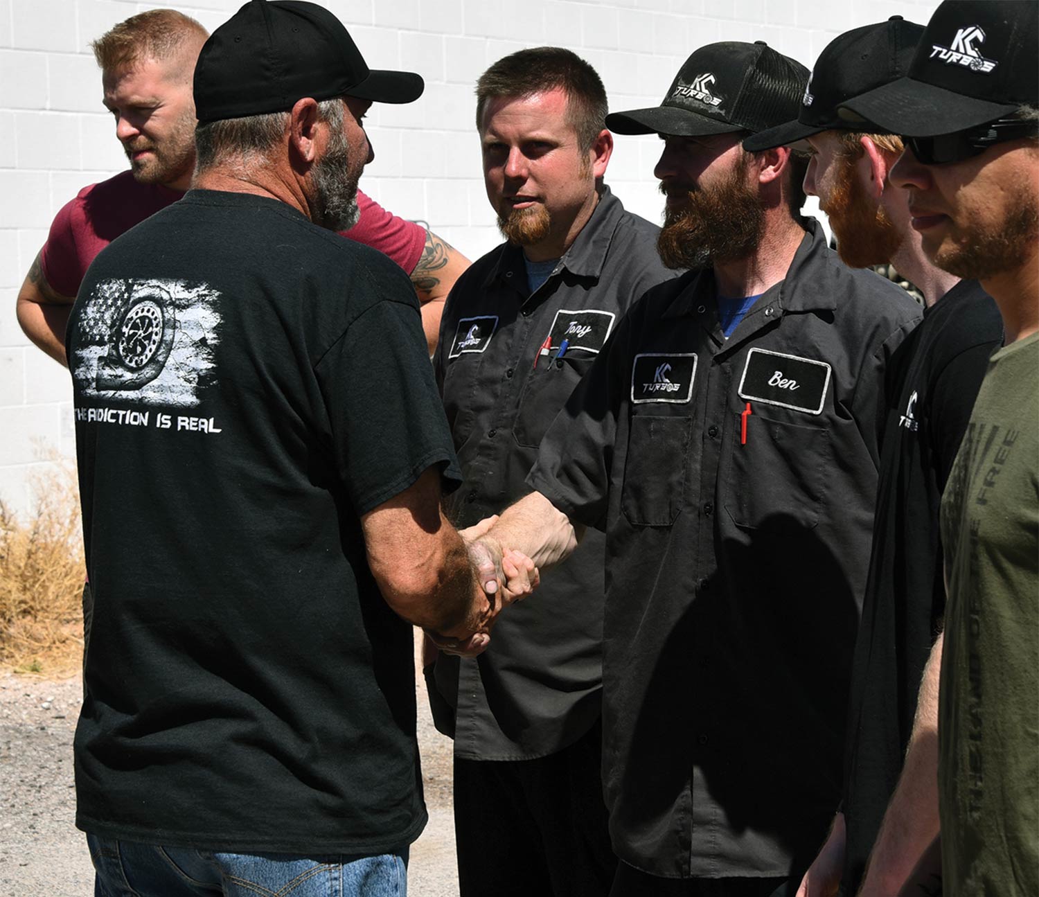 jade and mechanics shaking hands