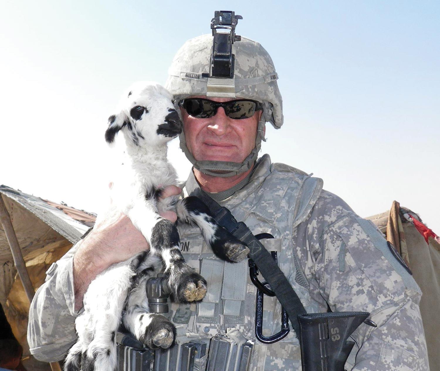 troop with goat in the dessert