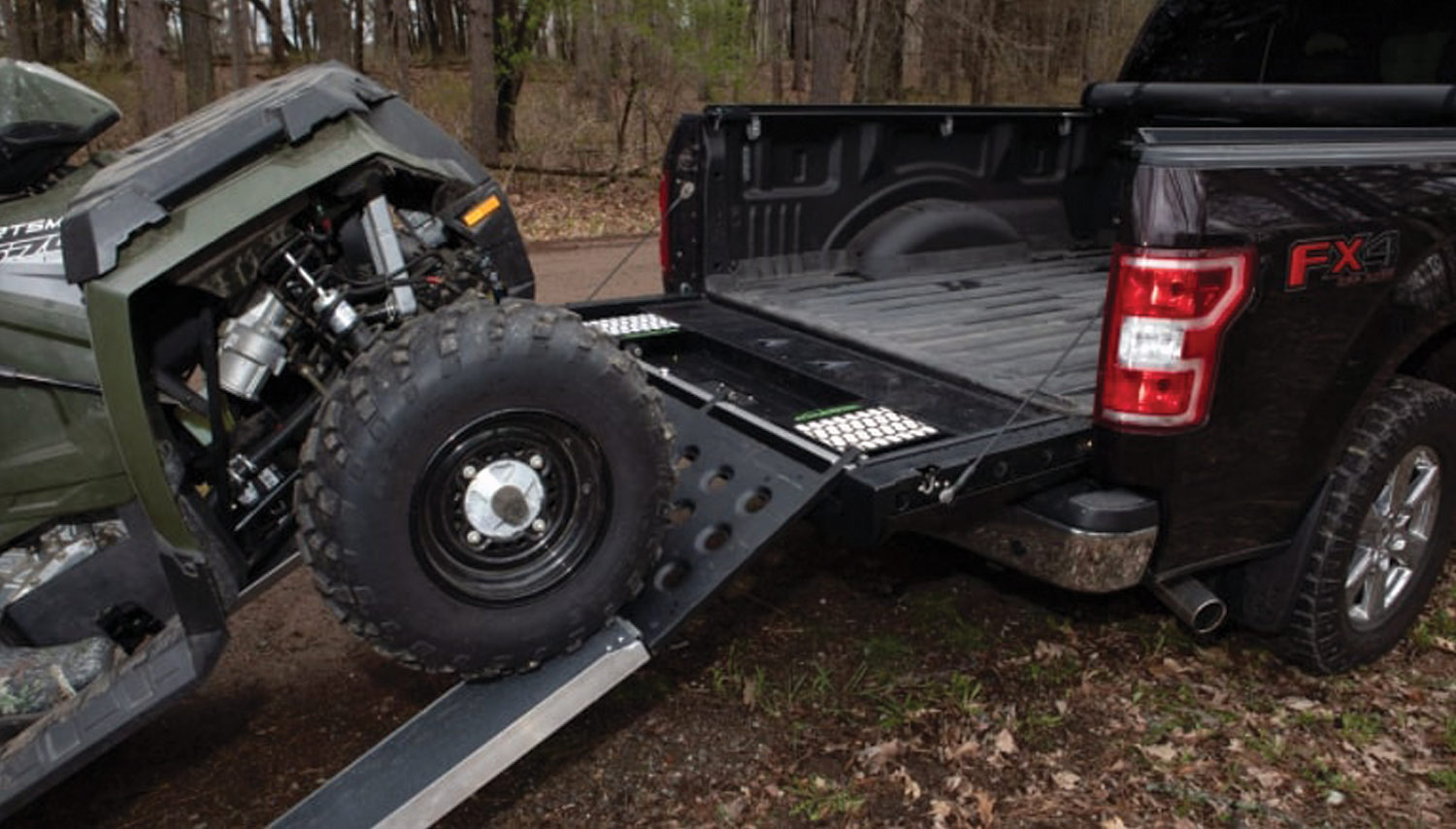 BringIt Multi-Function Tailgate being used to lift a UTV into a truck bed