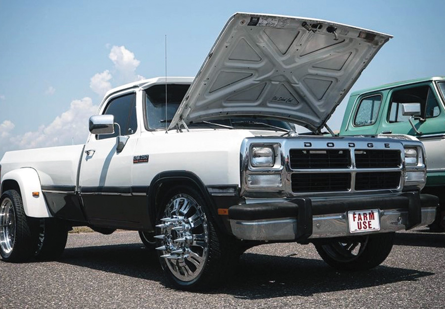 white truck with hood open