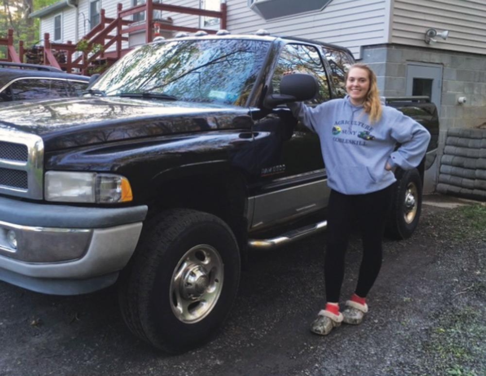 Alex next to her truck