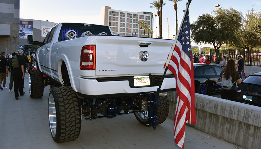 rear of white truck with American flag