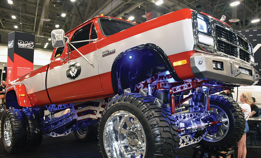 red and white striped truck with blue light underneath