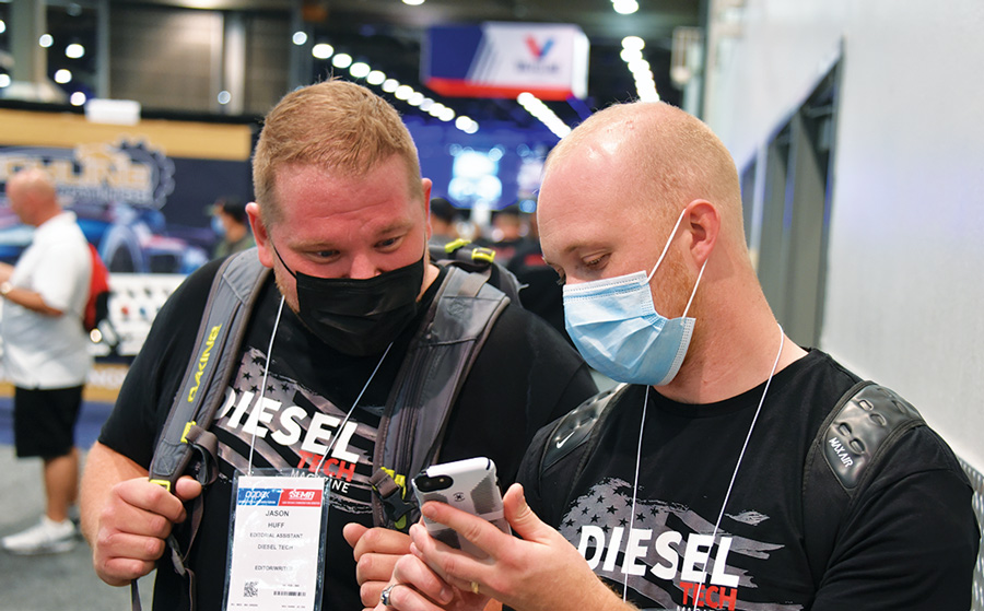 two mean wearing medical masks having a discussion