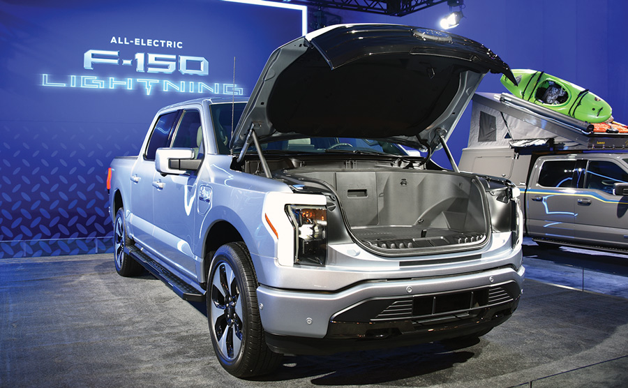 silver truck with hood open