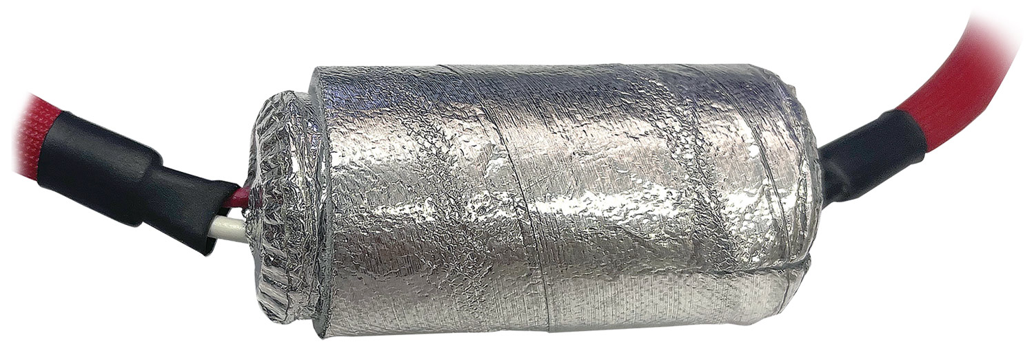 close up of a Design Engineering, Inc. Formed Sensor Cover on a wire connector