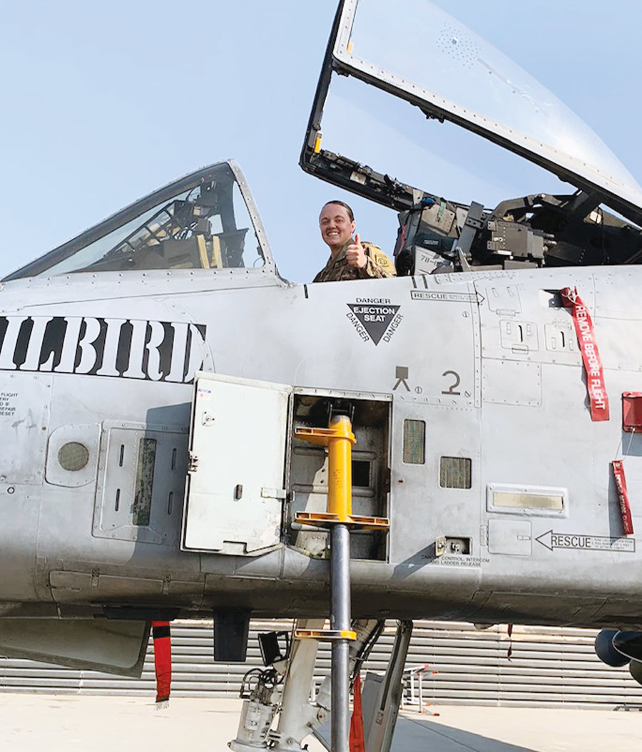 Sarina Kissell posing in a military aircraft