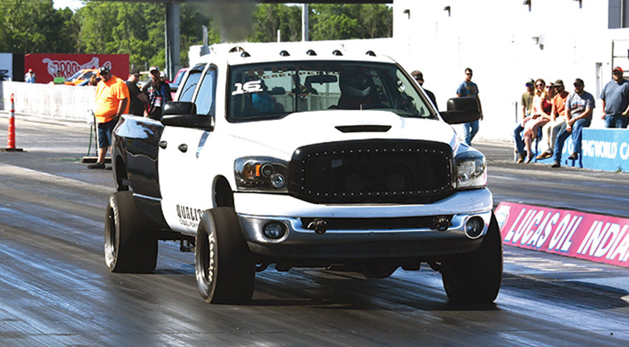 white truck with black cab in a drag race