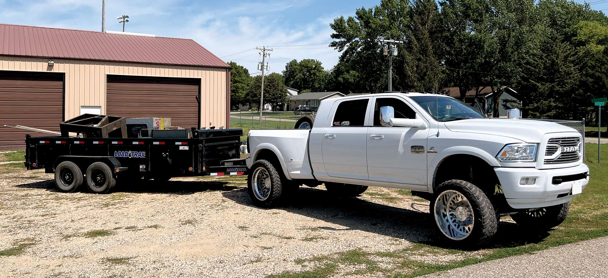 RAM truck with trailer hitched behind it