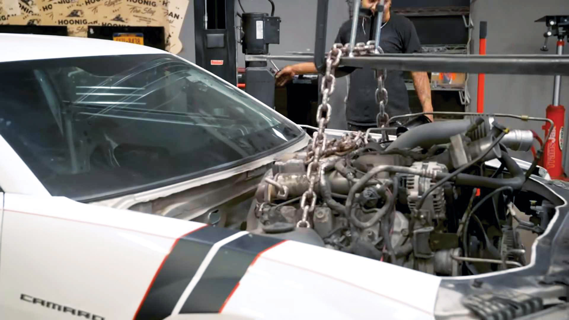 Stock Comaro engine being removed