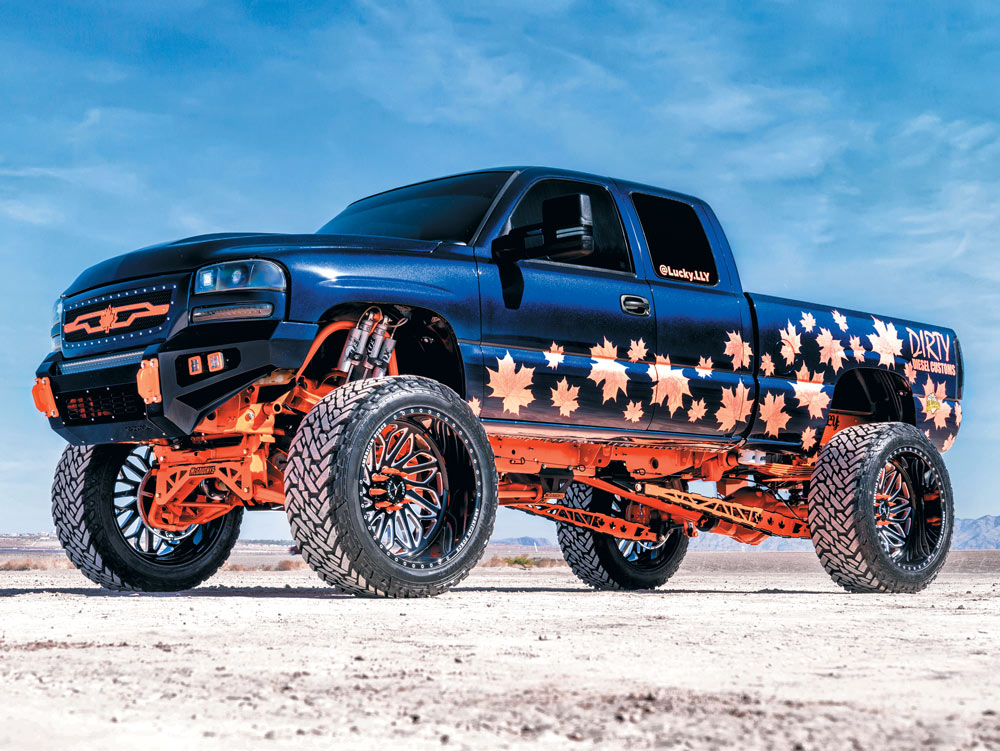 blue and orange truck with autumn leaves decals