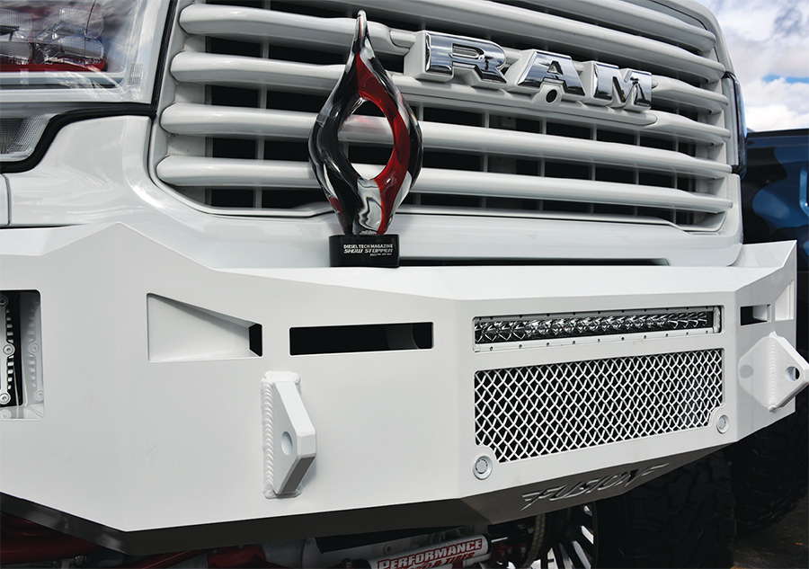 Diesel Tech Magazine 2022 Show Stopper Award sits on top of a white Fusion Bumpers American made steel bumper