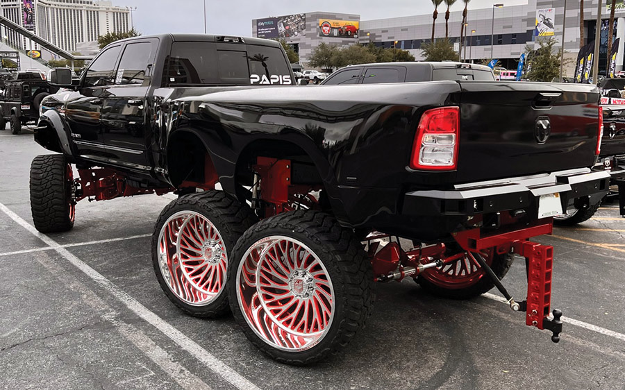 black truck with six wheels