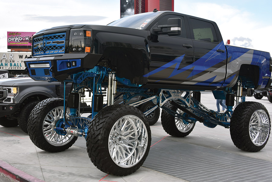 black lifted truck with blue trim
