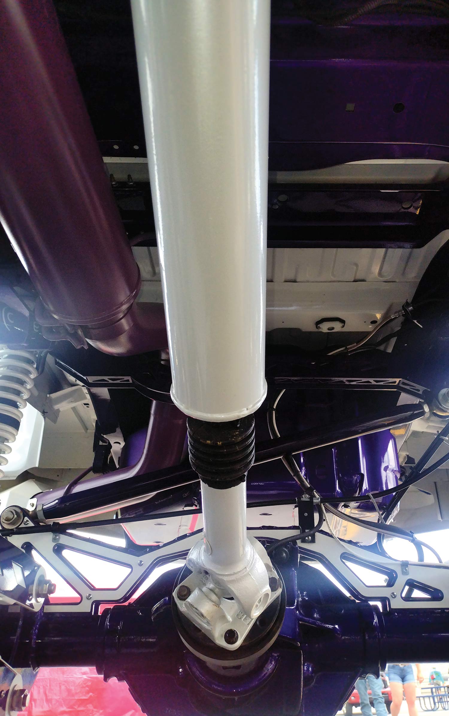 white shock absorber under the car