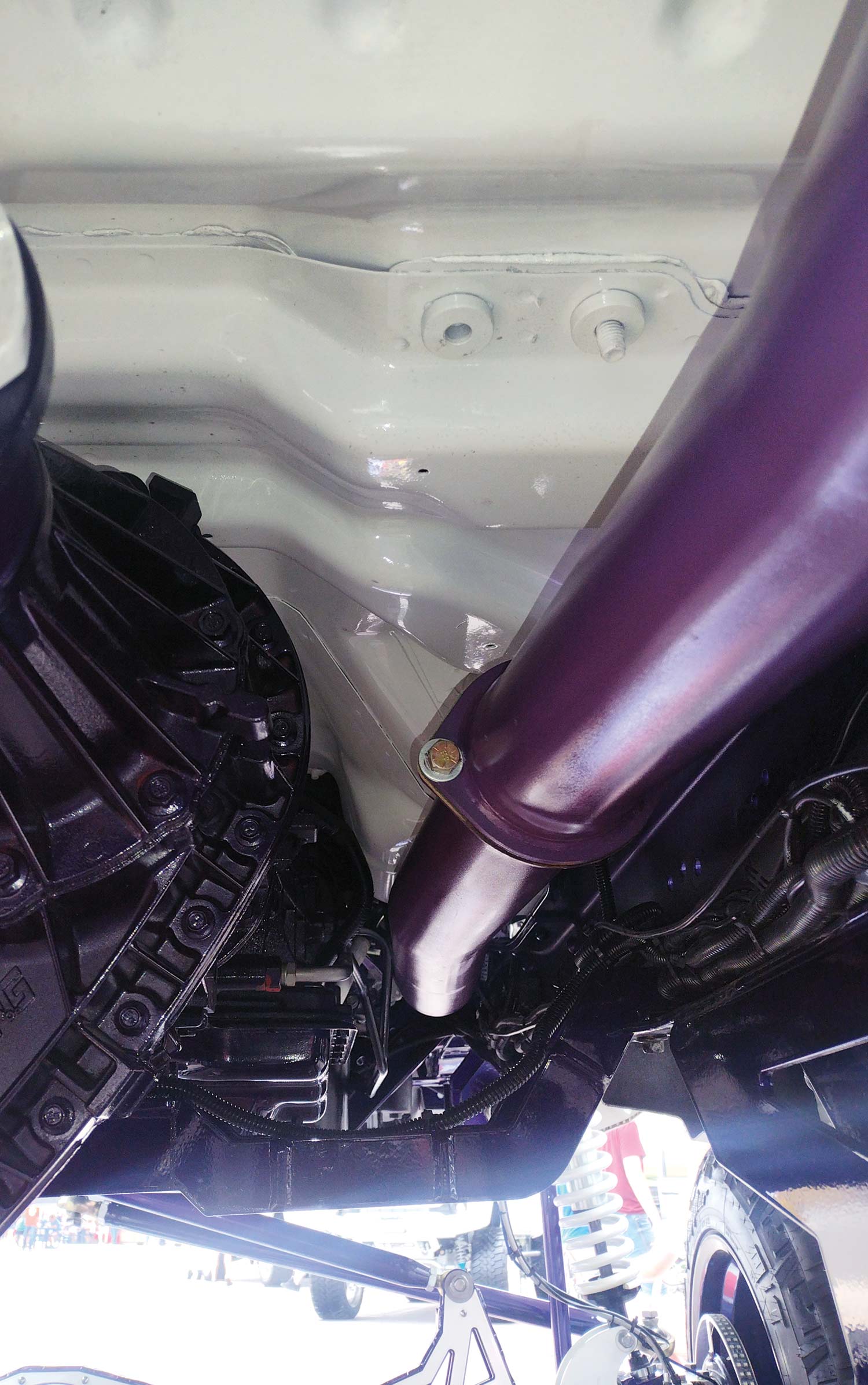 white and purple pipe under the car