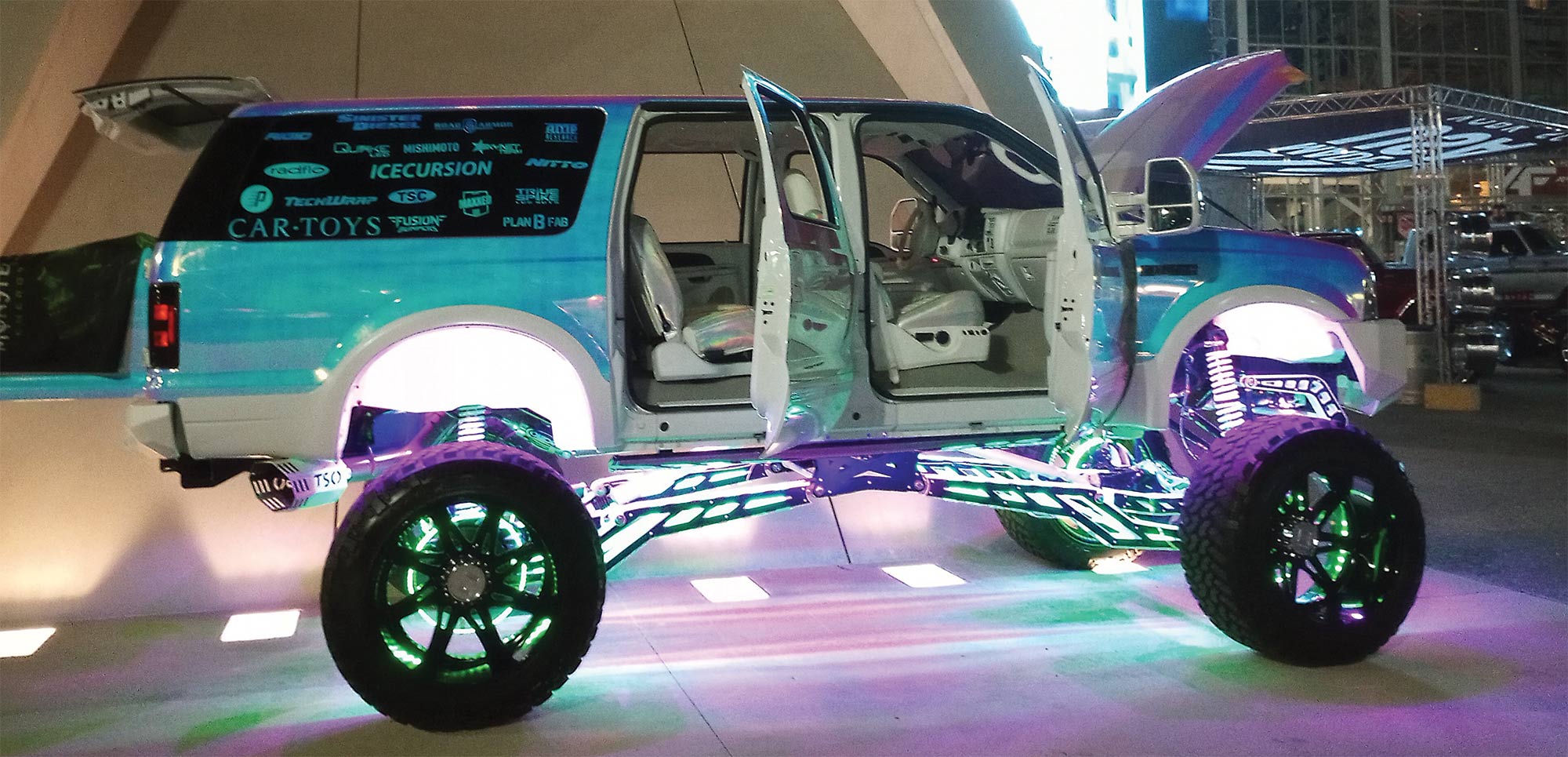 side profile of truck with doors, hood, and trunk open