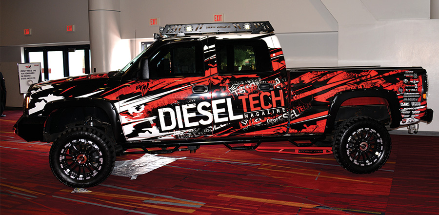 Red and black truck with the words Diesel Tech on the side of it